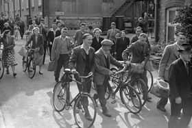Workers leaving the factory after a shift in 1950 with a significant proportion of them leaving with their bicycles.​