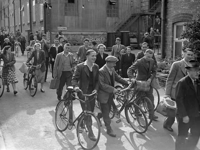 Workers leaving the factory after a shift in 1950 with a significant proportion of them leaving with their bicycles.​