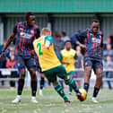 Carlos Mendes Gomes and Admiral Muskwe challenge for the ball against Hitchin