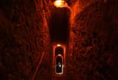 Visitor climb secret stairs inside Bran castle. Photo by DANIEL MIHAILESCU/AFP via Getty Images)