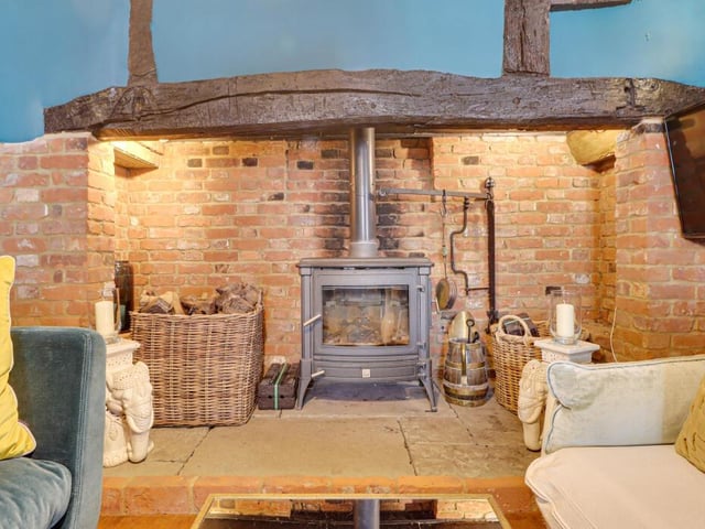 Next to this room, there is a hallway between the reception rooms with access to a large cellar, a wet room, and a downstairs W/C.