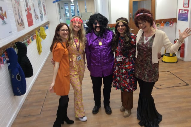 Staff dressed in 1970s outfits for the occasion