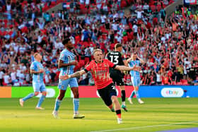 Joe Taylor wheels away after thinking he had scored the winner at Wembley - pic: Liam Smith