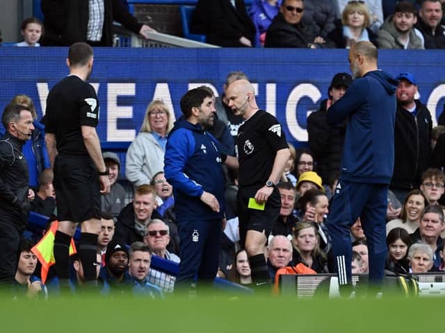 Anthony Taylor books Nottingham Forest assistant manager Rui Pedro Silva during the Reds' 2-0 defeat against Everton yesterday - pic: Gareth Copley/Getty Images