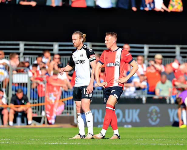 Cauley Woodrow is marked by Fulham defender Tim Ream on Sunday - pic: Liam Smith