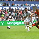 Carlton Morris fires home his first goal for the Hatters at Swansea on Saturday - pic: Gareth Owen
