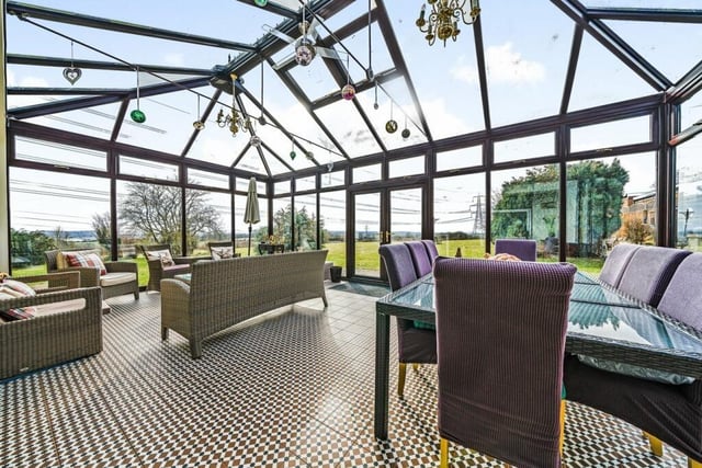 The conservatory features french doors that lead to the garden