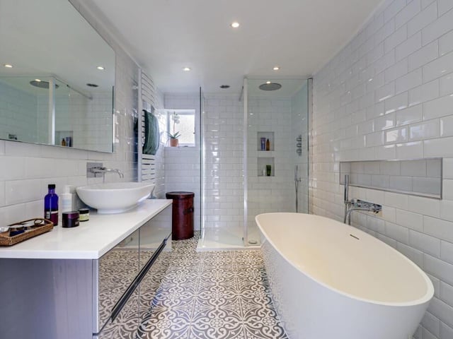 This is the stylish family bathroom, complete with a freestanding bath and walk-in shower.