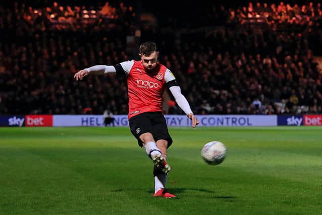 Ryan Tunnicliffe sends over a cross during his time with Luton - pic: Liam Smith