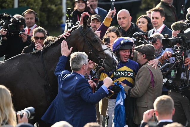 Former champion jockey Peter Scudamore, partner of trainer Lucinda Russell, embraces rider Derek Fox after a superb victory by CORACH RAMBLER in last year's Randox Grand National at Aintree. It came only a month after the mercurial chaser, based in Scotland, had completed successive wins in the Ultima Handicap Chase on the opening day of the Festival. Now the 10yo goes for the big one with an ambitious tilt at the Boodles Gold Cup on Friday (3.30) before returning to Aintree next month. Only two horses, Golden Miller and L'Escargot, have ever pulled off the Gold Cup/National double -- the former exactly 90 years ago.