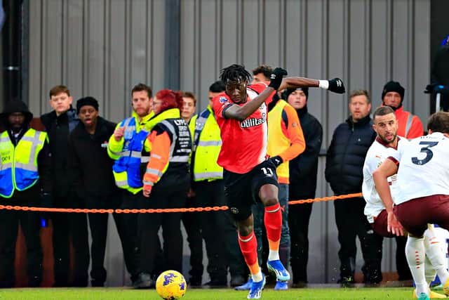 Elijah Adebayo breaks away from a challenge against Manchester City - pic: Liam Smith