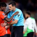 Andrew Madley chats with Issa Kabore during Luton's 1-1 draw with Liverpool earlier this season - pic: Catherine Ivill/Getty Images
