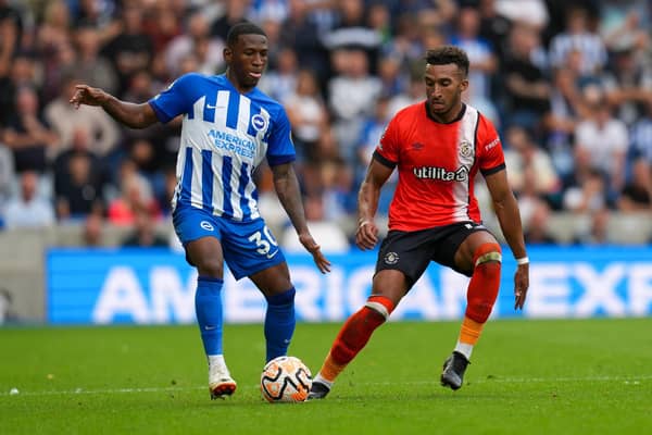 Jacob Brown keeps an eye on Brighton's Pervis Estupinan during his Luton Town debut at the Amex Stadium - pic: David Horn