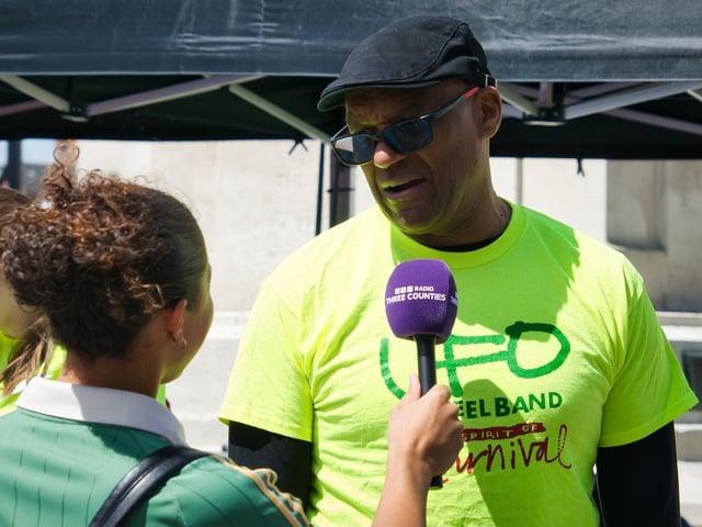 Colin Salmon speaking after his steel pan performance.