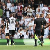 Carlton Morris remonstrates with referee Michael Salisbury after he wasn't awarded a penalty against Fulham - pic: Christopher Lee/Getty Images