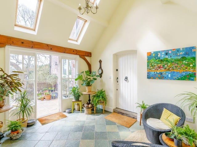 This glorious garden room has easy access to the outdoors and has skylights to let all that sunshine in.