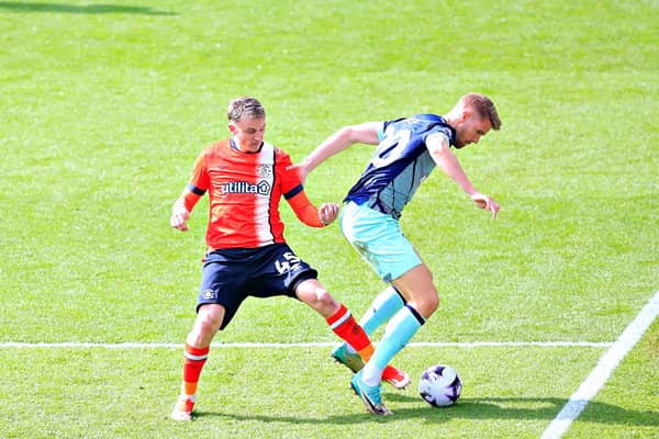 Alfie Doughty looks to make a challenge against Brentford on Saturday - pic: Liam Smith