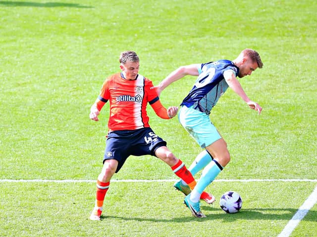 Alfie Doughty looks to make a challenge against Brentford on Saturday - pic: Liam Smith