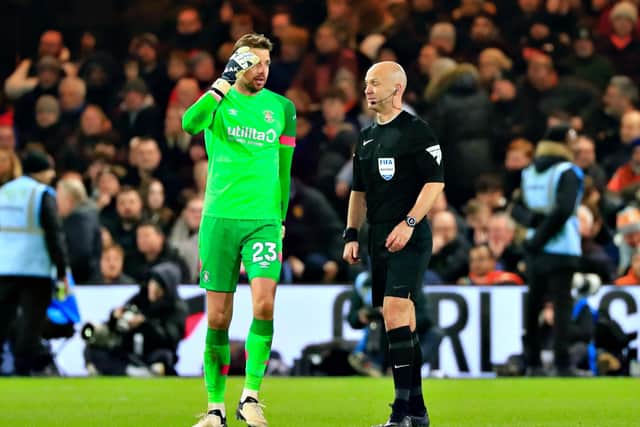 Town keeper Tim Krul in discussion with referee Anthony Taylor - pic: Liam Smith