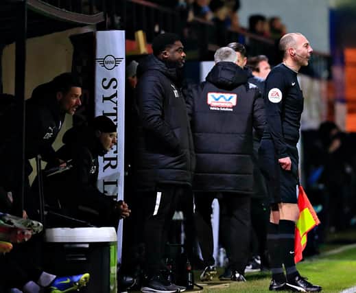 Kolo Toure takes charge of Wigan's 1-1 draw at Kenilworth Road earlier this month