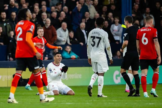 Casemiro sees yellow from referee David Coote during Manchester United's 2-1 win at Kenilworth Road - pic: Ash Donelon/Manchester United via Getty Images