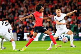 Tahith Chong comes under pressure from James Ward-Prowse during Luton's 2-1 defeat to West Ham - pic: Liam Smith