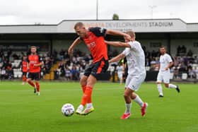 George Saville shields the ball against Boreham Wood on Saturday - pic: Andy Rowland / PRiME Media Images