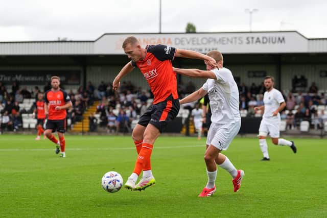 George Saville shields the ball against Boreham Wood on Saturday - pic: Andy Rowland / PRiME Media Images