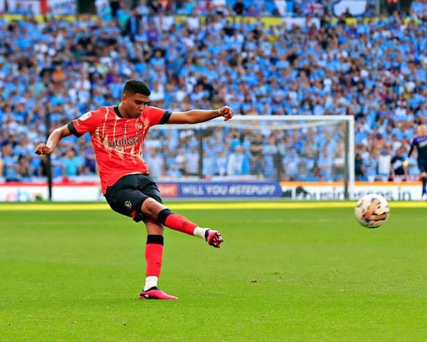 Cody Drameh sends over a cross in the play-off final