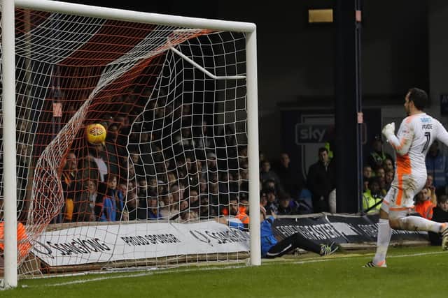 Cambridge keeper David Forde can only watch as he is beaten by Olly Lee's shot from inside his own half