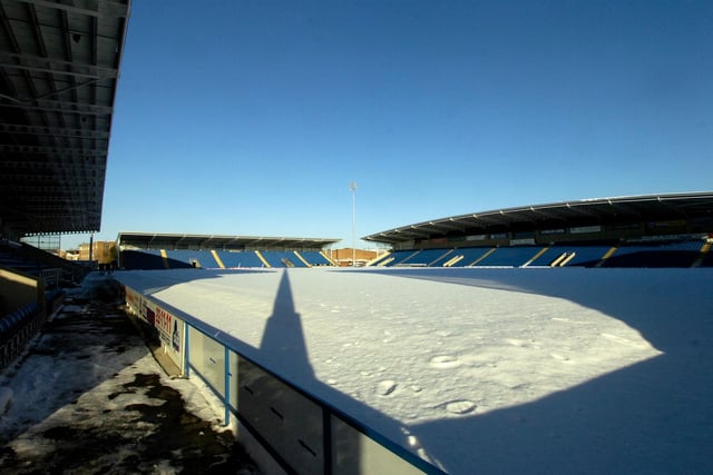 A nearby spire casts an eerie shadow on the snowbound pitch at Chesterfield FC's stadium in 2010.