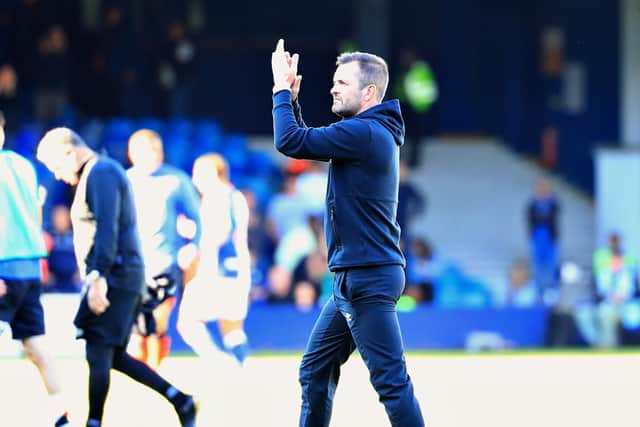 Hatter boss Nathan Jones applauds the Luton fans this afternoon