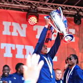 Amari'i Bell lifts the Championship play-off winners' trophy at St George's Square