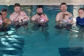 Caroline with parents and their little ones in the pool