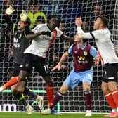 Burnley keeper James Trafford and Town forward Elijah Adebayo collide as Carlton Morris's header was allowed to stand during Luton's 1-1 draw at Burnley last Friday - pic: OLI SCARFF/AFP via Getty Images