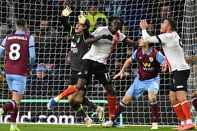 Burnley keeper James Trafford and Town forward Elijah Adebayo collide as Carlton Morris's header was allowed to stand during Luton's 1-1 draw at Burnley last Friday - pic: OLI SCARFF/AFP via Getty Images