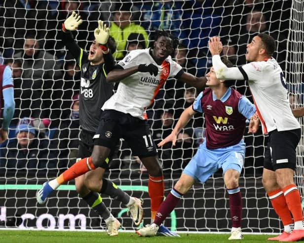 Burnley keeper James Trafford and Town forward Elijah Adebayo collide as Carlton Morris's header was allowed to stand during Luton's 1-1 draw at Burnley last Friday - pic: OLI SCARFF/AFP via Getty Images