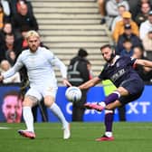 Jordan Clark looks to move the ball on against MK Dons - pic: Jane Russell