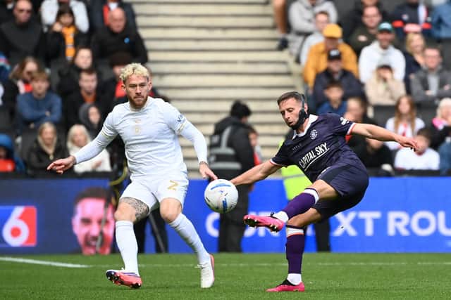 Jordan Clark looks to move the ball on against MK Dons - pic: Jane Russell