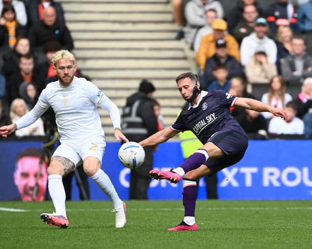 Jordan Clark looks to move the ball on against MK Dons - pic: Jane Russell