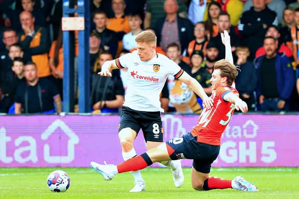 Luke Freeman slides in against Hull City this afternoon
