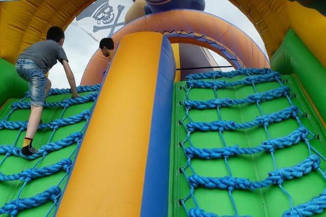 Filme image of children climbing a pirate-themed bouncy castle. Picture: HardyS/Pixabay