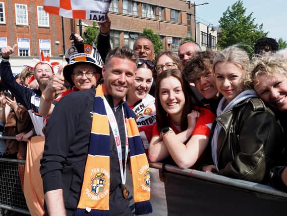 Smiles all around for Luton's victorious homecoming