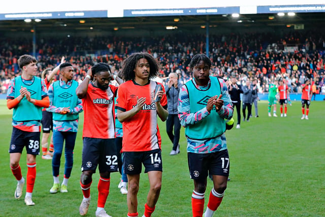 Luton's players applaud their fans as they leave Kenilworth Road for the dressing room.