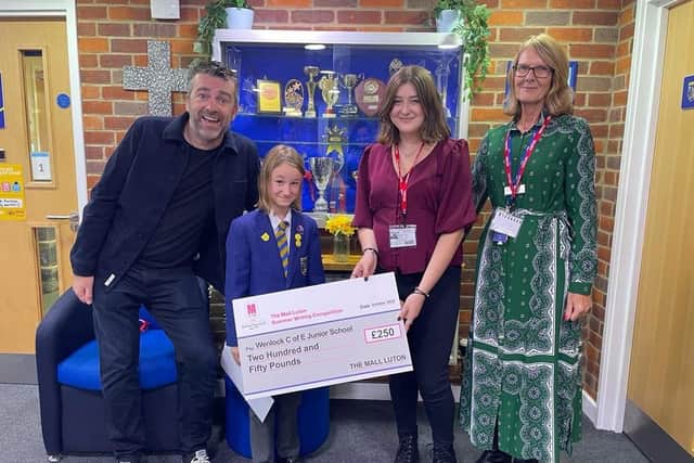 Eden Williams of Wenlock C of E school was one of the winners of The Mall's children's writing competition. One of the judges was best-selling children's author Chris Smith (left)