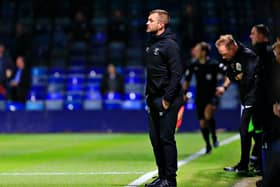 Hatters boss Nathan Jones watches on against Huddersfield this evening