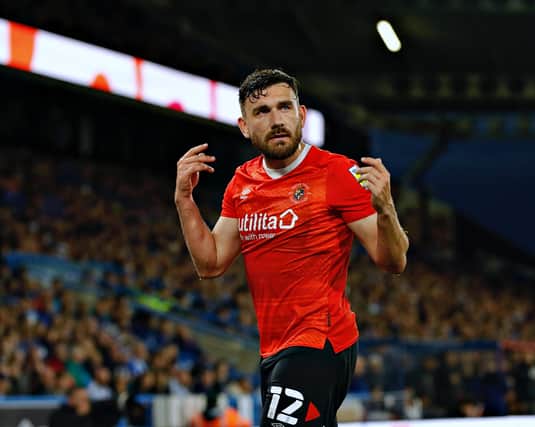 Robert Snodgrass encourages the travelling Luton fans at Huddersfield on Monday night