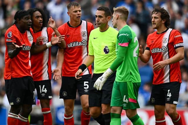 Luton's players appeal to referee David Coote after he awarded a penalty against the Hatters at the Amex Stadium on Saturday - pic: Mike Hewitt/Getty Images