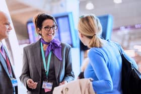 Staff speaking to a guest at Luton airport. Picture: London Luton Airport