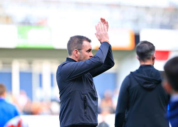 Nathan Jones applauds the Luton fans against Sunderland this afternoon